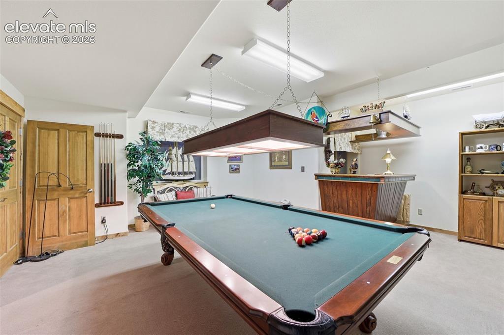 Image 34 of 50: Basement Level Salon / Game Room