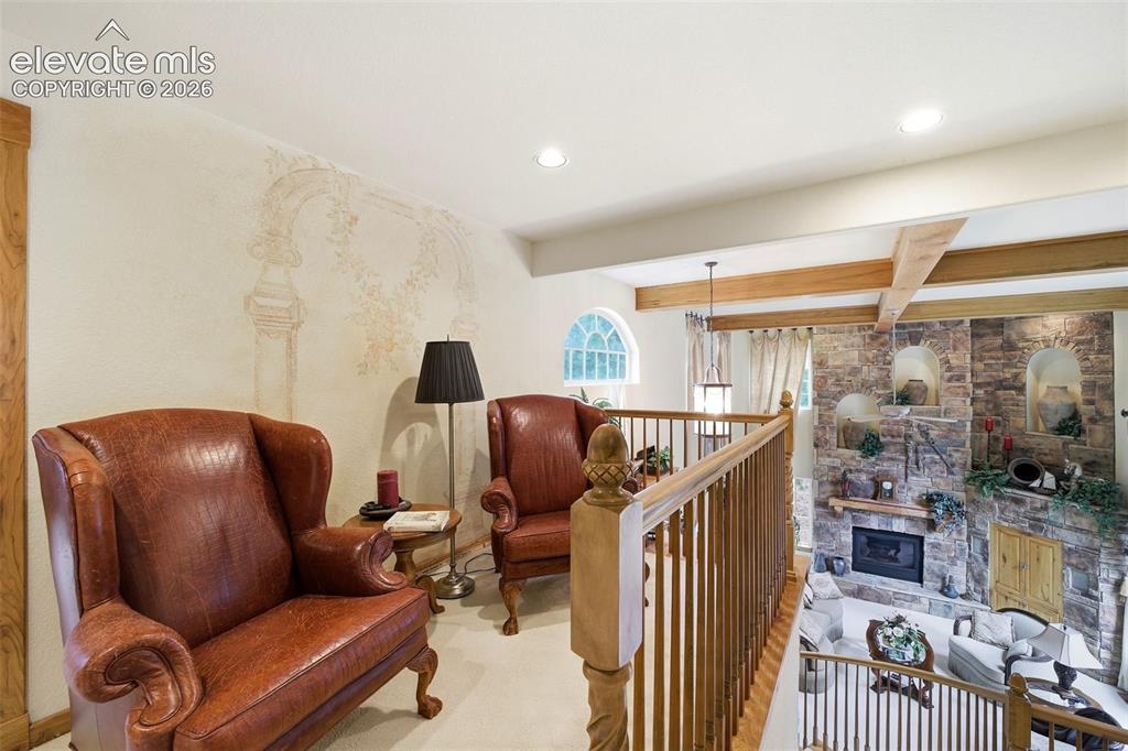 Image 35 of 50: Upper level sitting loft overlooking great room