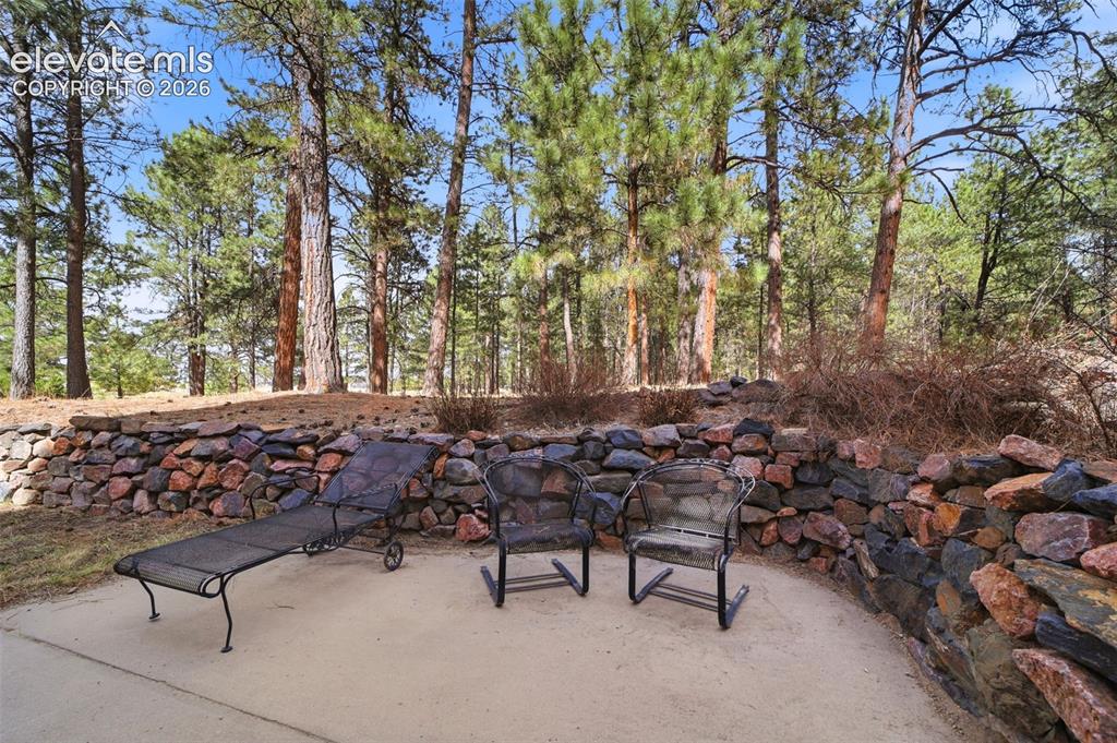 Image 8 of 50: Side patio off the walk out sliding door