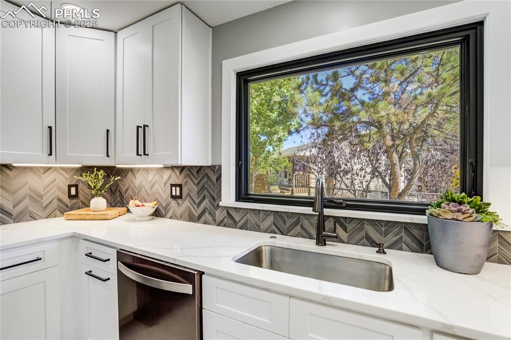 Image 19 of 46: Window overlooking backyard