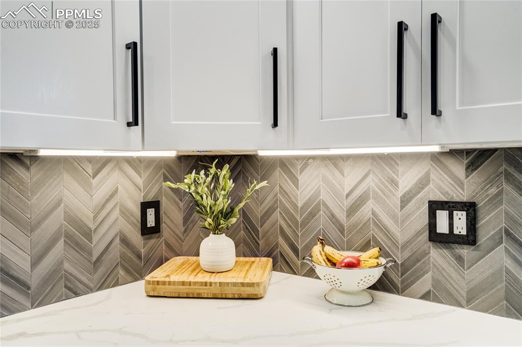 Image 20 of 46: Mudroom/Wetbar Primary bedroom with canned lighting, modern ceiling fan and
