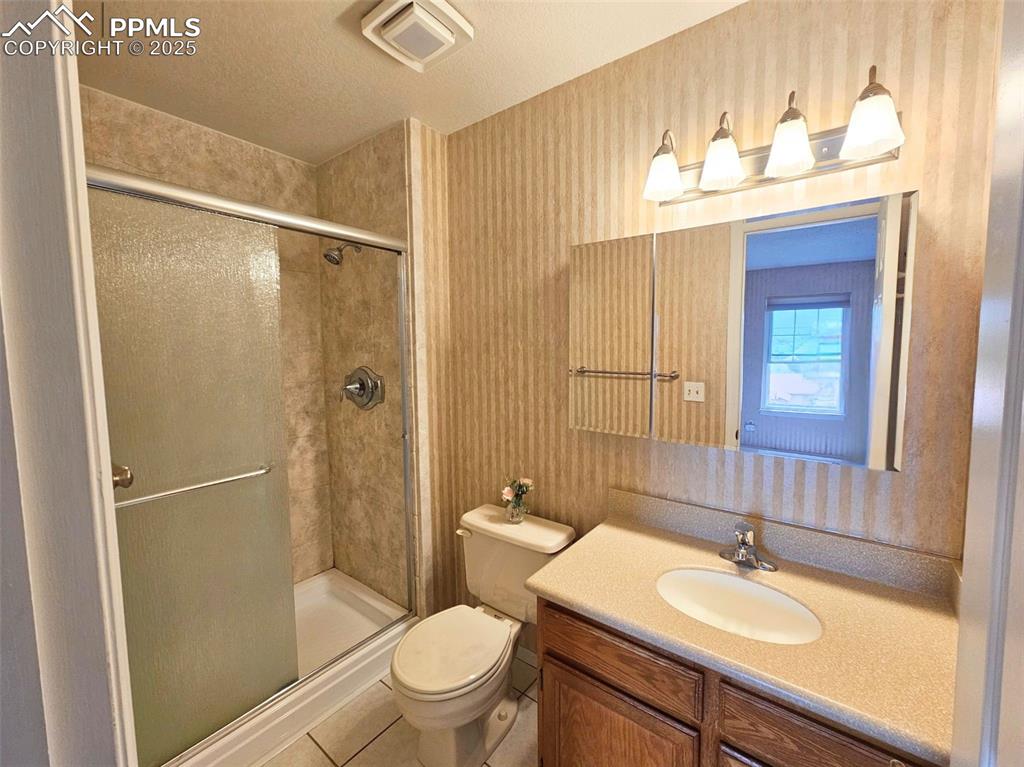 Image 13 of 36: attached master bathroom