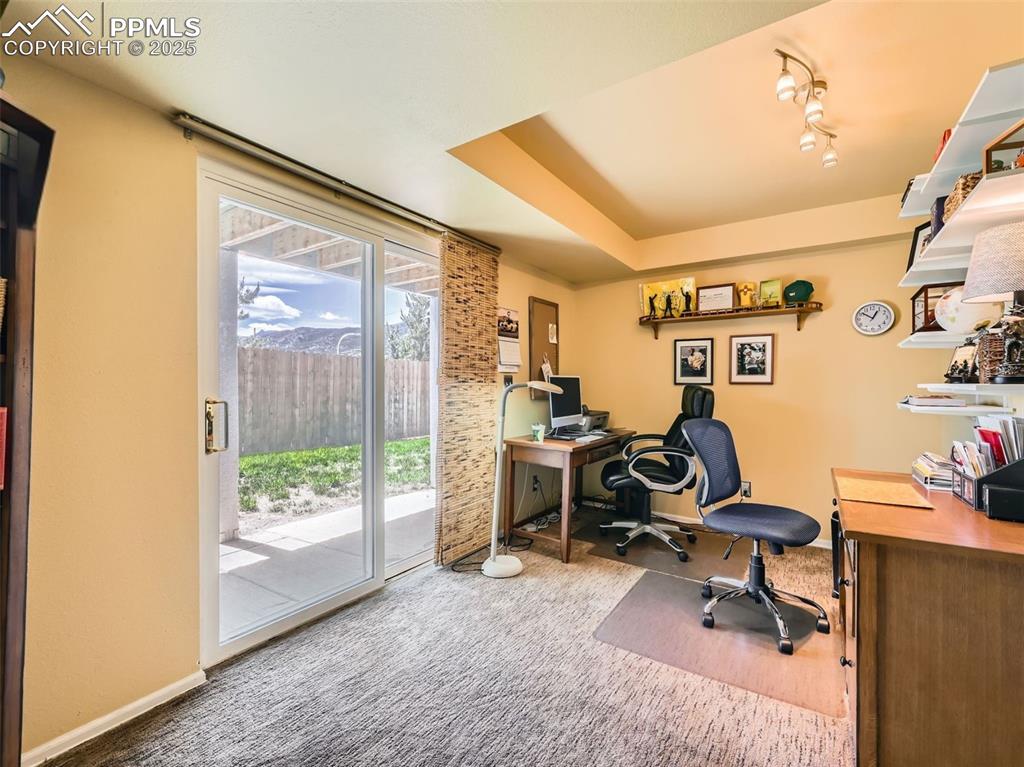 Image 17 of 36: office with walkout covered patio