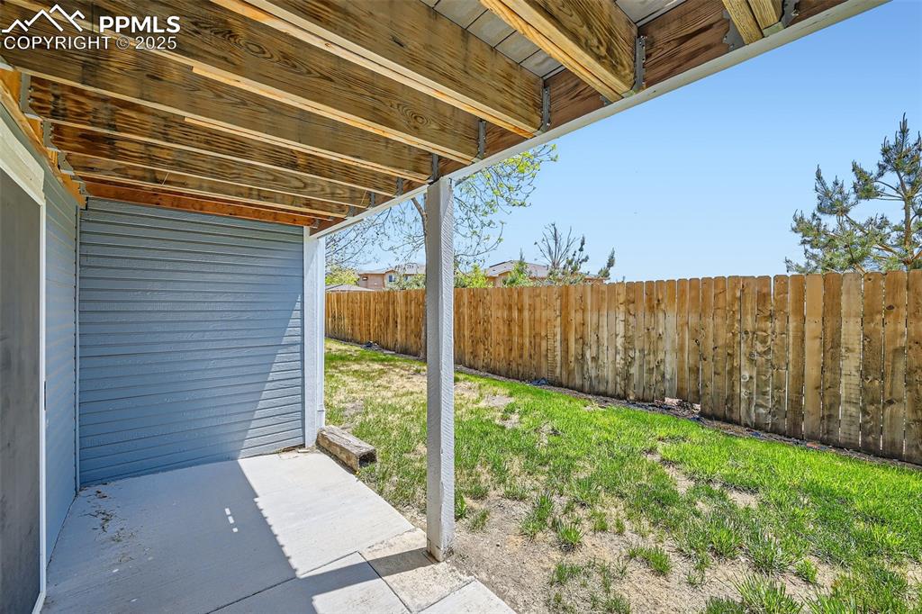 Image 26 of 36: covered patio from walkout in basement