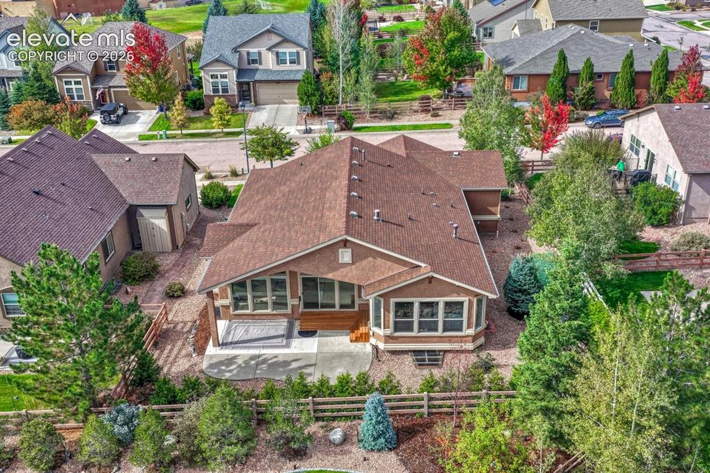 Image 14 of 50: Aerial rear view of home and backyard.