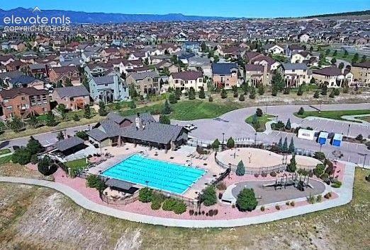 Image 48 of 50: Aerial view of the Wolf Ranch Community Center, pool, and splash park.