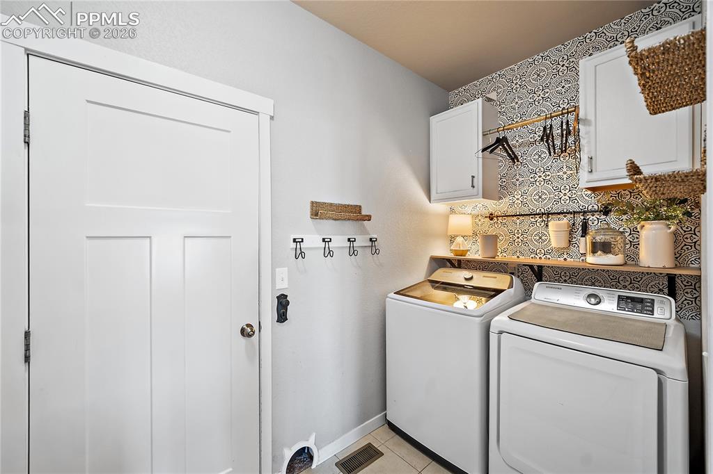 Image 17 of 44: Main level laundry with access to the garage. 