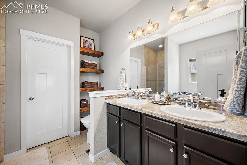 Image 21 of 44: Primary bath, double vanity