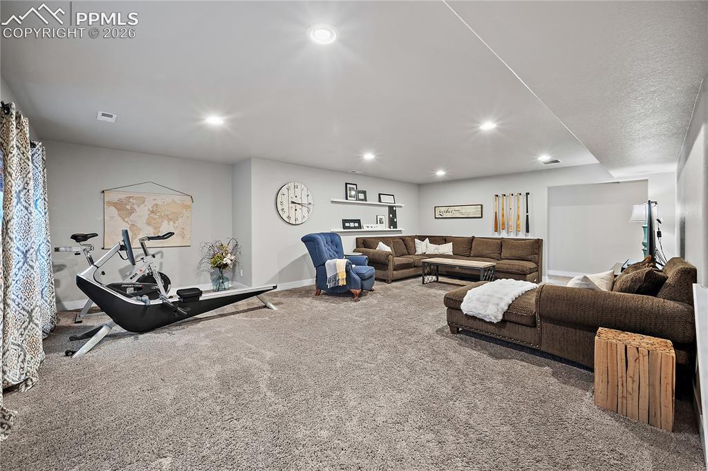Image 24 of 44: Fully finished basement with spacious family room.