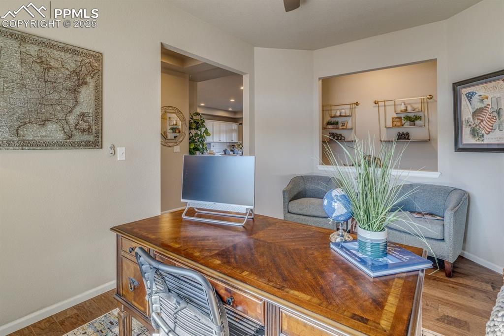 Image 15 of 50: Home office with baseboards and wood finished floors