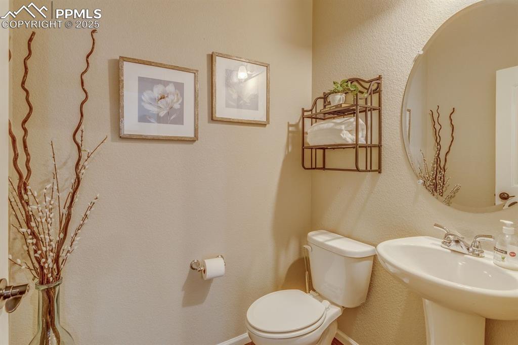 Image 16 of 50: Bathroom with a textured wall