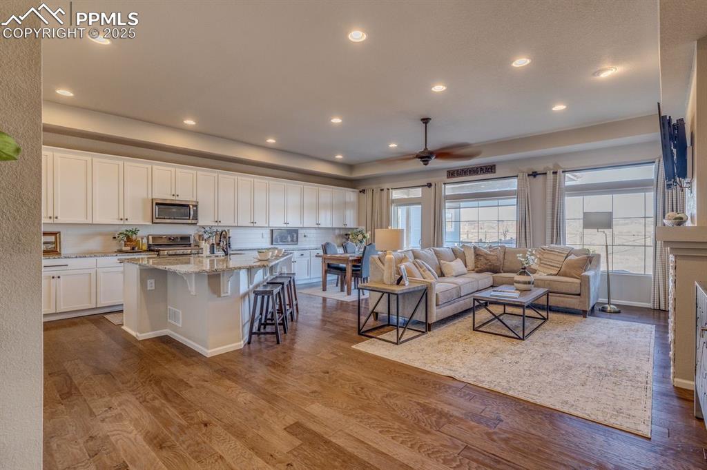 Image 2 of 50: Great room concept! Beautiful engineered hardwood floors.