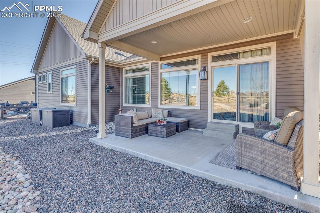 Image 36 of 50: View of patio with an outdoor hangout area