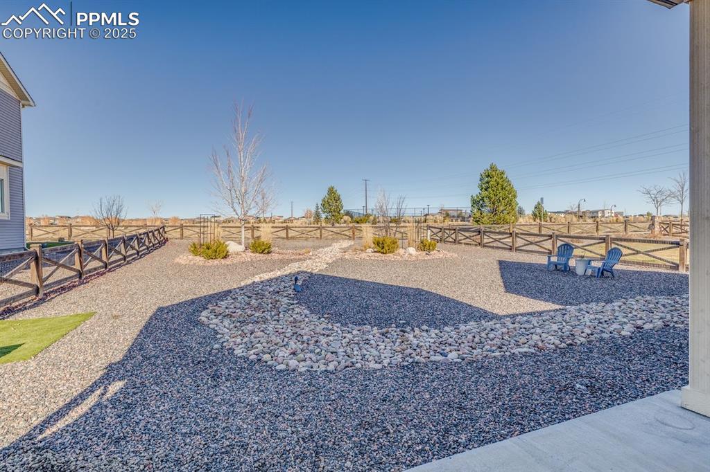 Image 43 of 50: View of fenced backyard