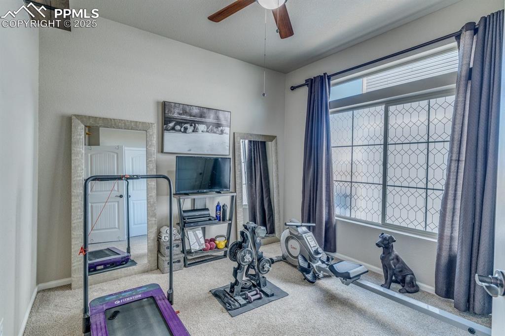 Image 6 of 50: Second bedroom currently being used as a workout room.