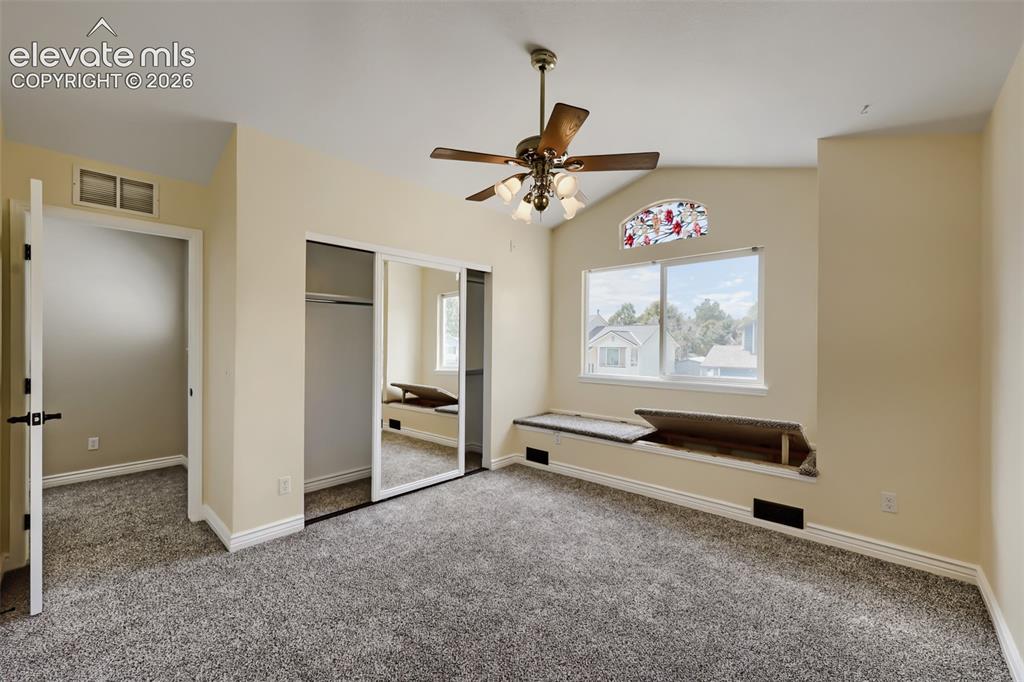 Image 12 of 27: Primary Bedroom with window seat