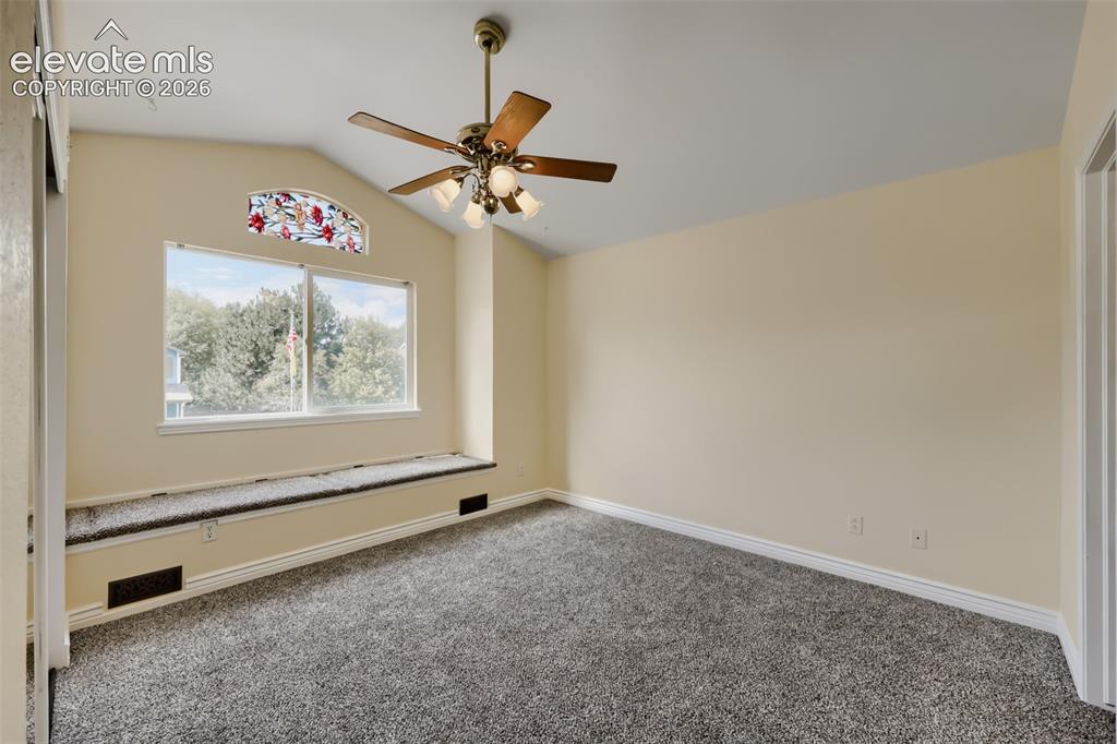 Image 13 of 27: Primary bedroom with ceiling fan