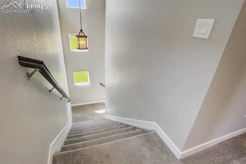 Image 20 of 45: stairs up to both bedrooms and their on- suite bathrooms