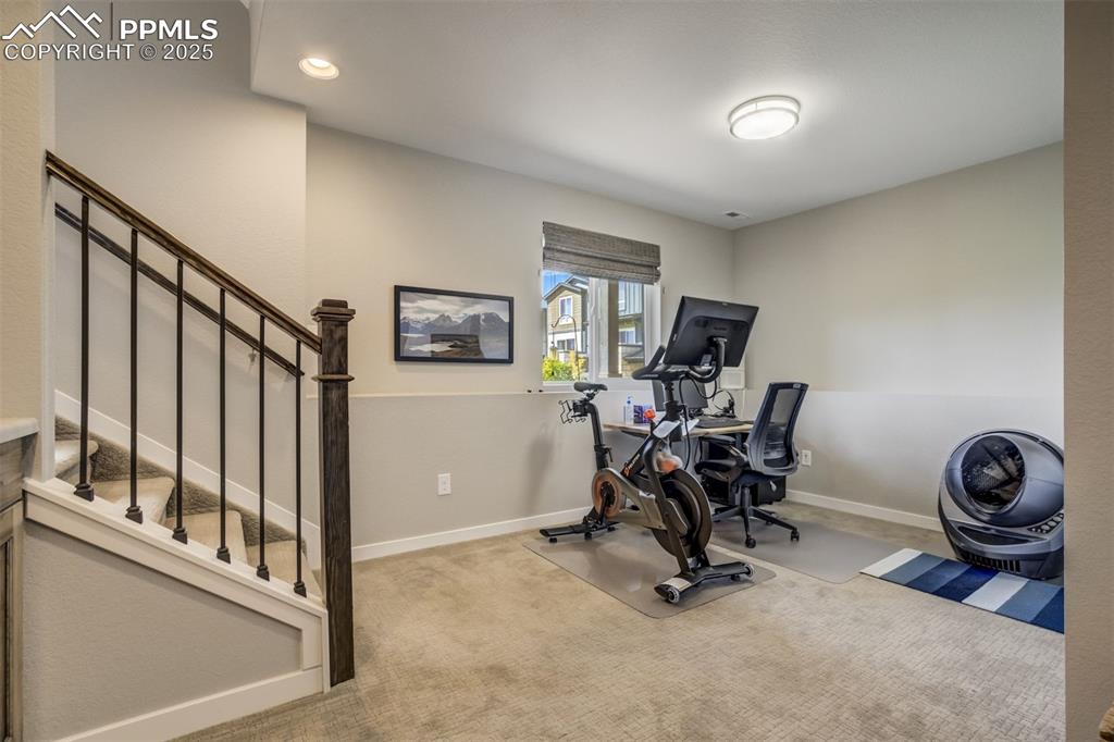 Image 33 of 45: lower level bonus room, walks into garage,