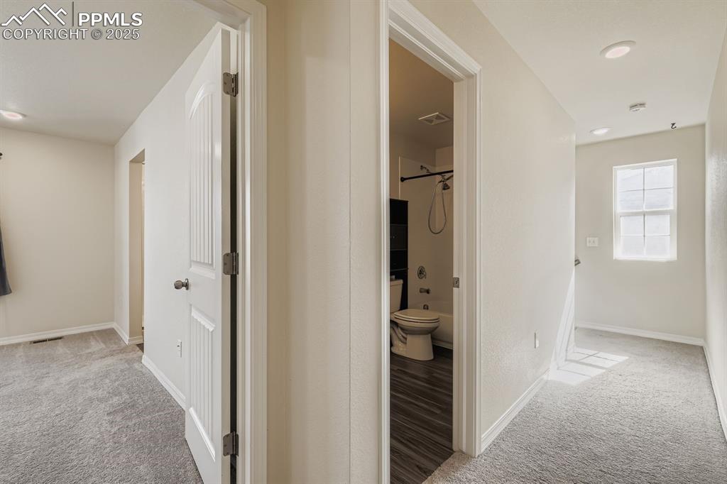 Image 14 of 26: Corridor featuring light carpet and recessed lighting