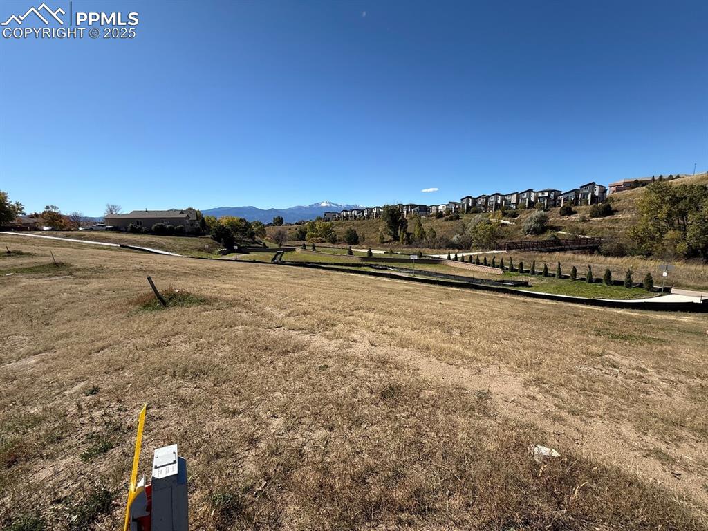 Image 3 of 4: View of mountain background featuring rural landscape