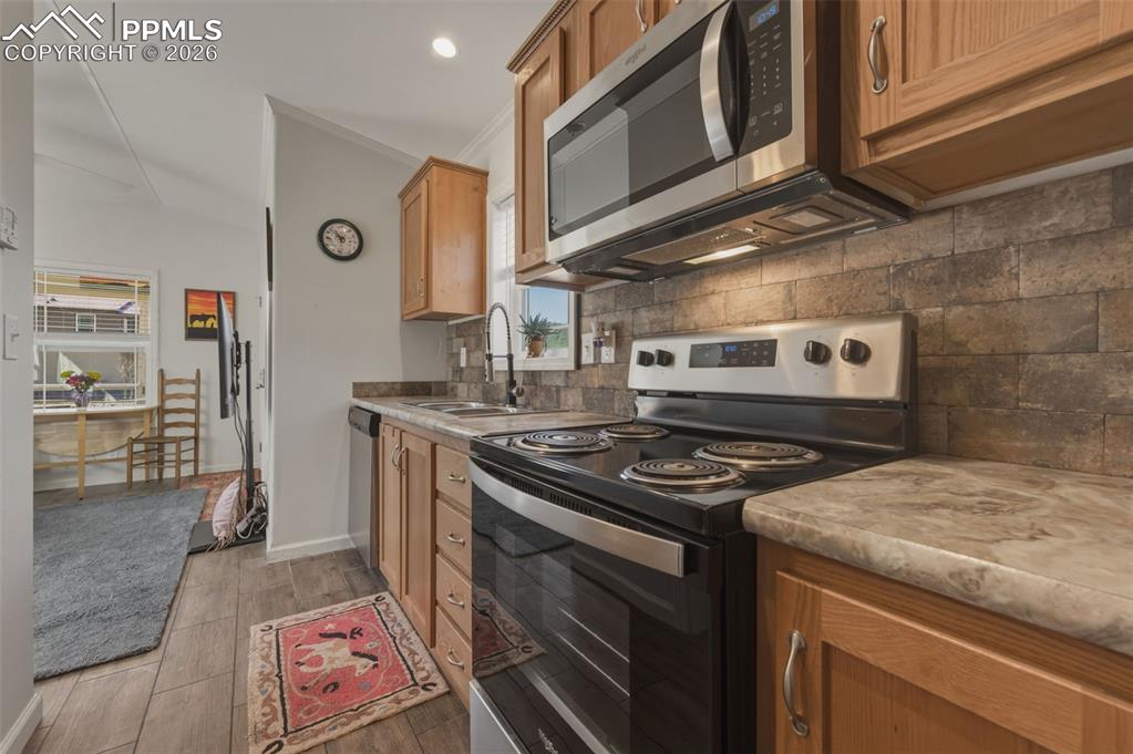 Image 14 of 23: View of kitchen toward living area