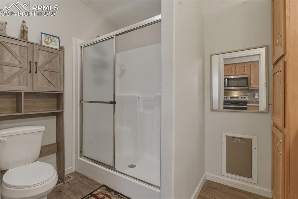 Image 16 of 23: Good sized bathroom doubles as a place for the doggies if needed.