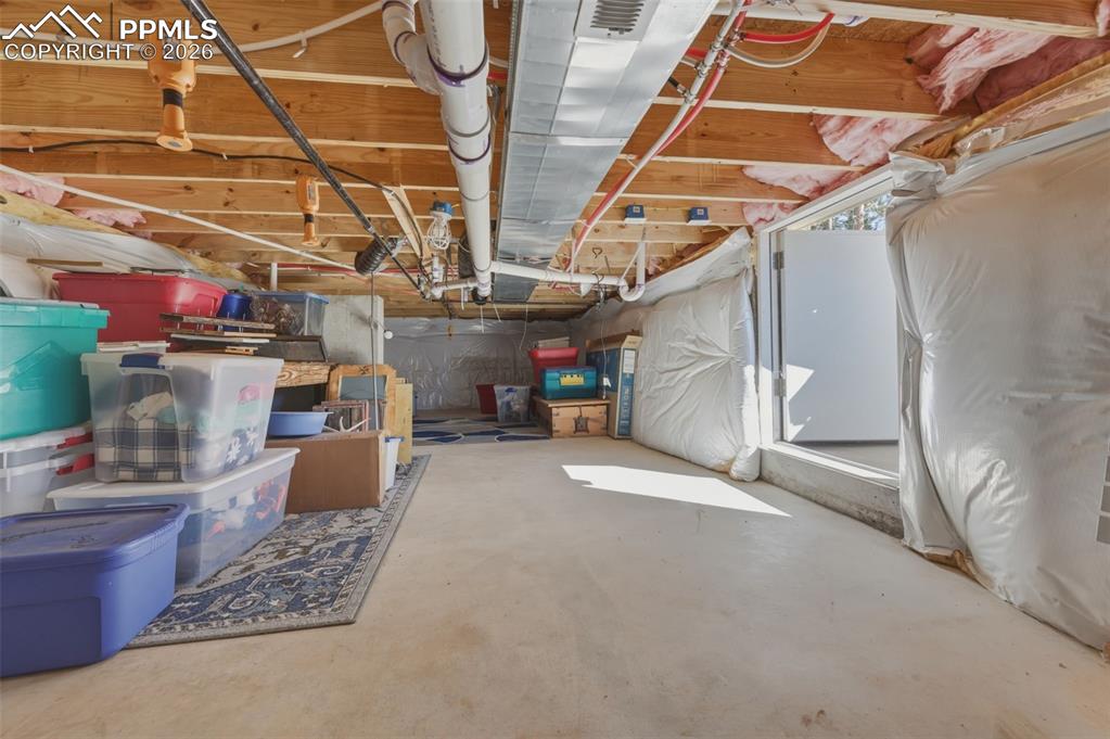 Image 5 of 23: Tons of space for storage in the crawl space. 