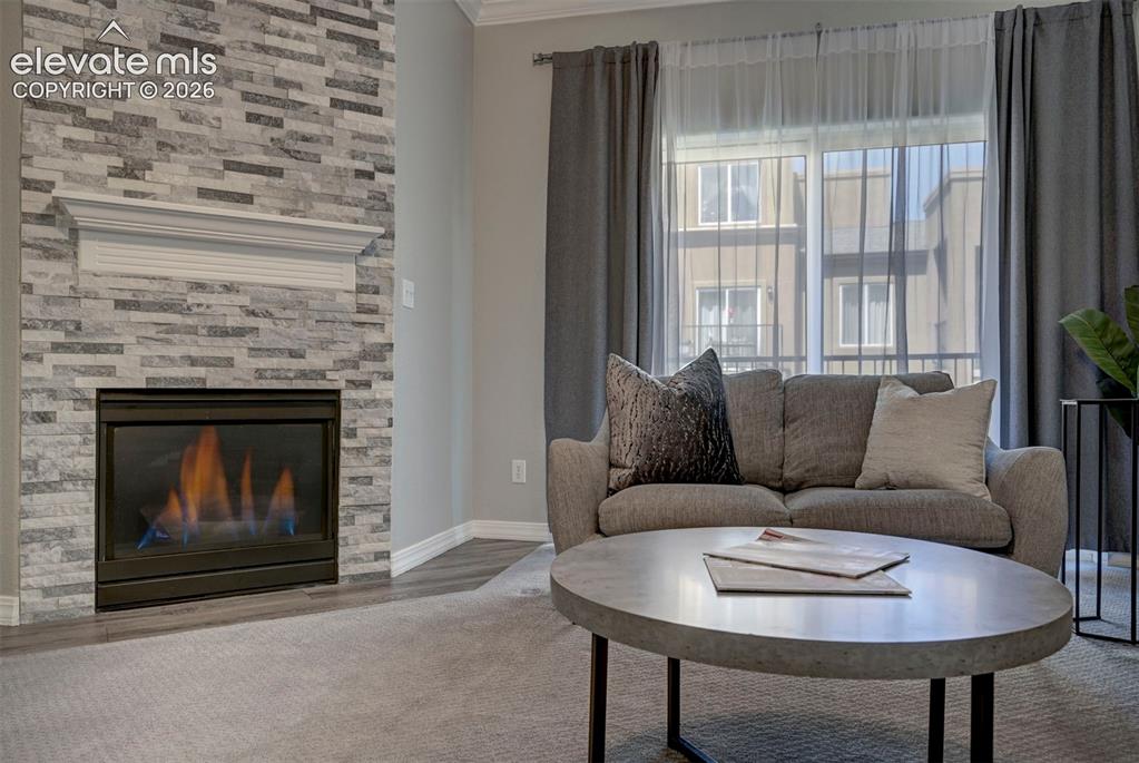 Image 12 of 40: Gas Fireplace and Walkout to private patio