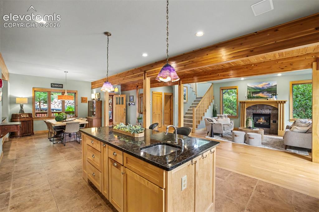 Image 12 of 50: The open-concept kitchen connects seamlessly to the dining and living areas