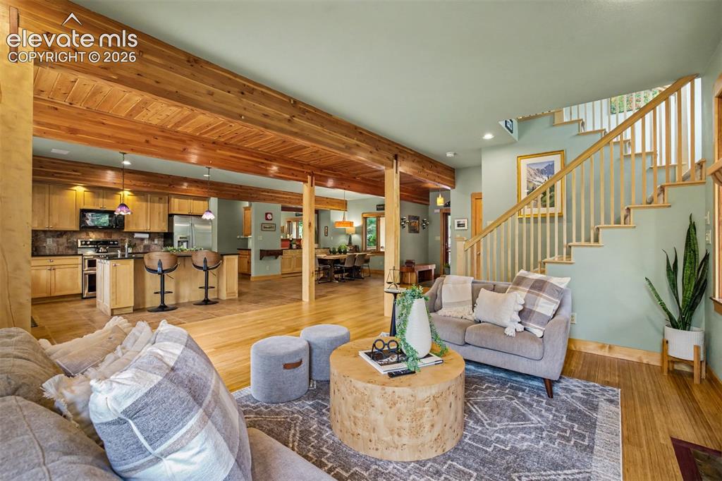 Image 17 of 50: A spacious open floor plan allows the kitchen, dining and living spaces to 