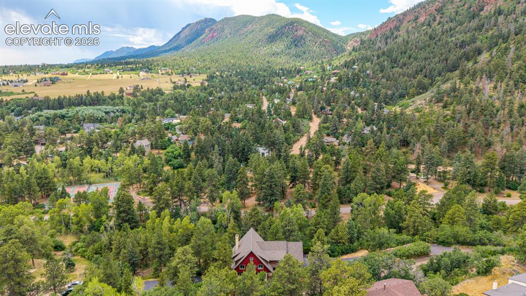 Image 2 of 50: Chautauqua Mountain rises above the property, showcasing the spectacular se
