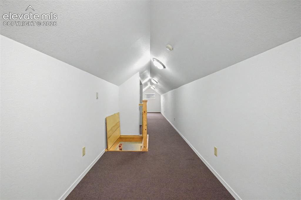 Image 30 of 50: The upstairs loft offers flexible space with windows and a closet, making i