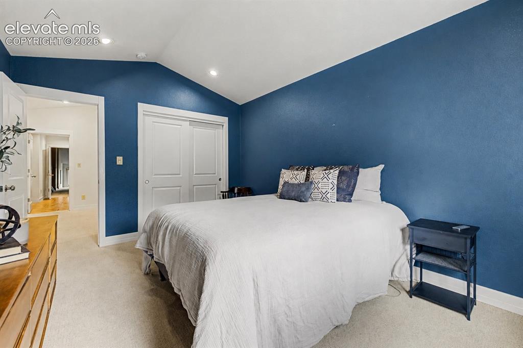 Image 32 of 50: The private upper-level guest bedroom is accessed by its own staircase from