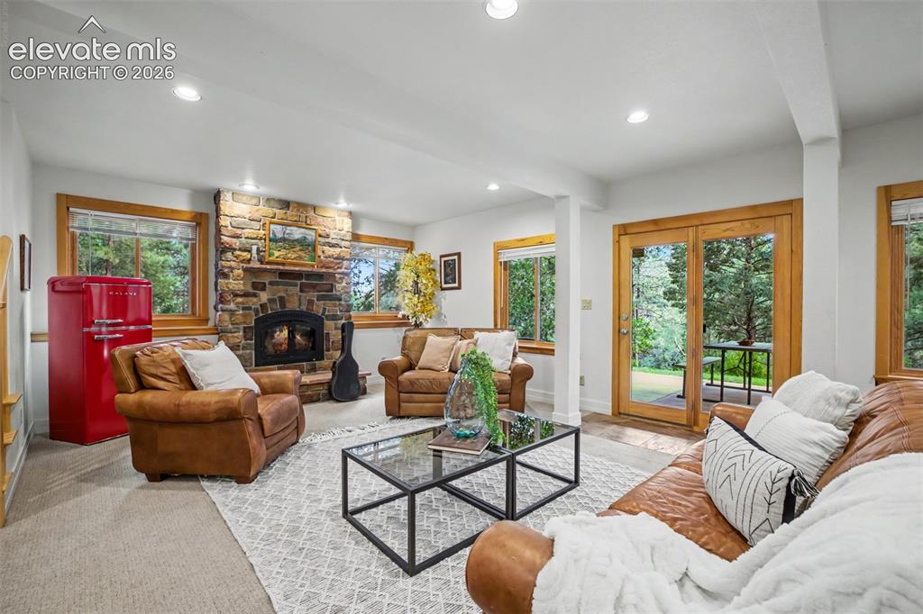 Image 36 of 50: The basement walk-out family room offers another inviting gathering space w