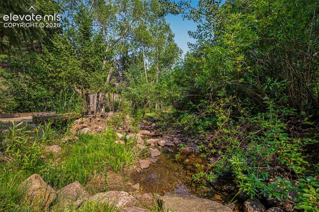 Image 42 of 50: Monument Creek winds through the property, creating a peaceful setting that
