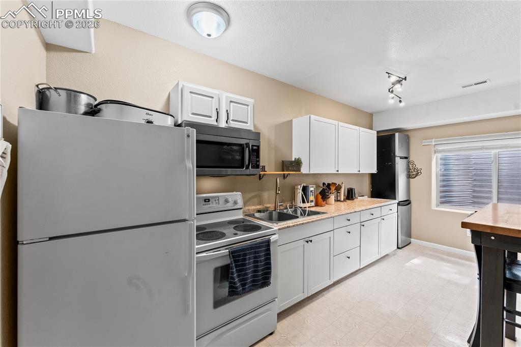 Image 27 of 50: 2nd Kitchen