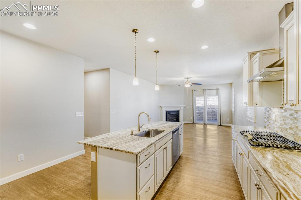 Image 11 of 49: oversized granite island, farmhouse sink