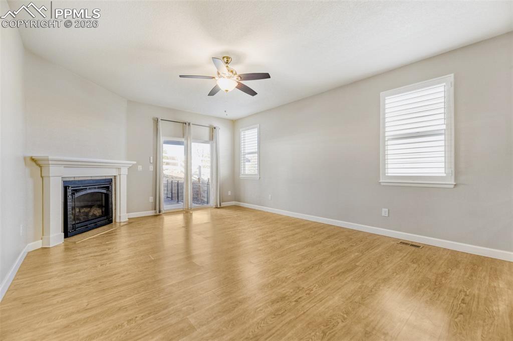 Image 15 of 49: luxury vinyl plank, access to patio