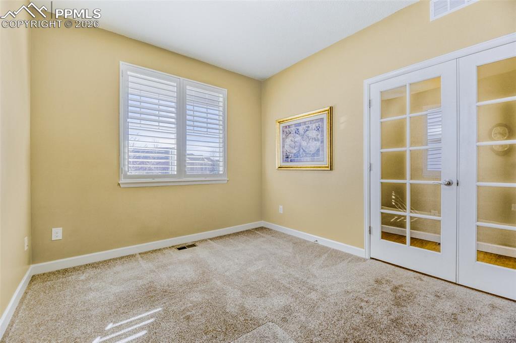 Image 19 of 49: plantation shutters (office, living, primary)