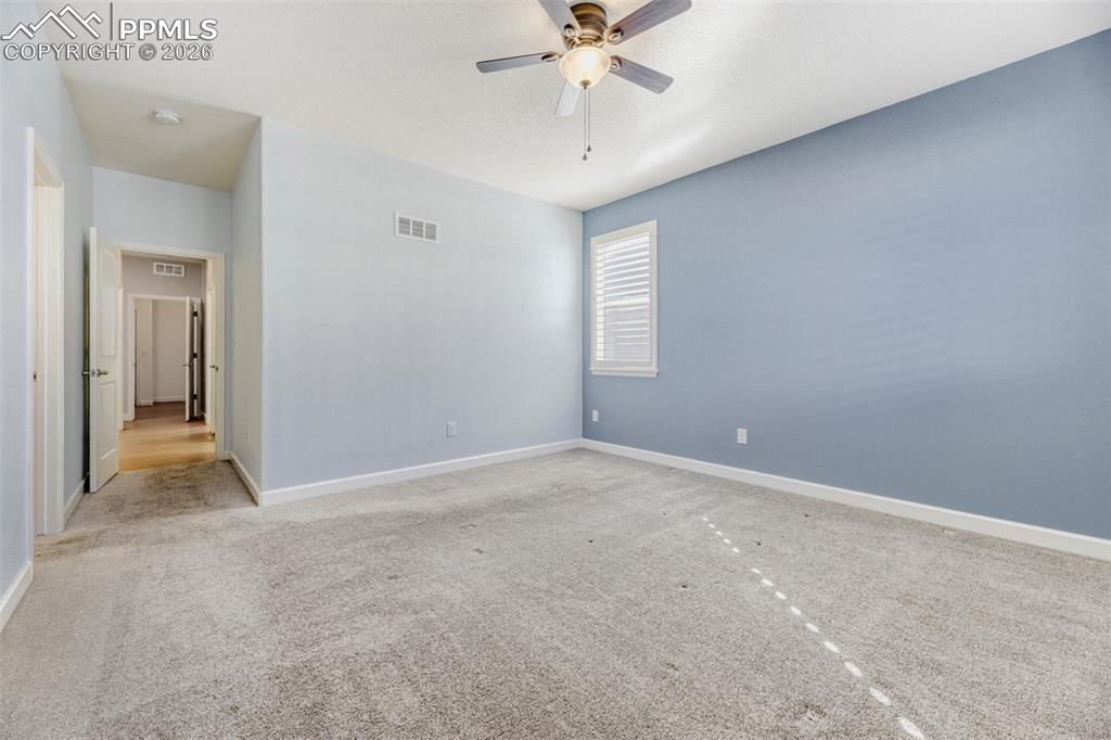 Image 21 of 49: spacious primary bedroom