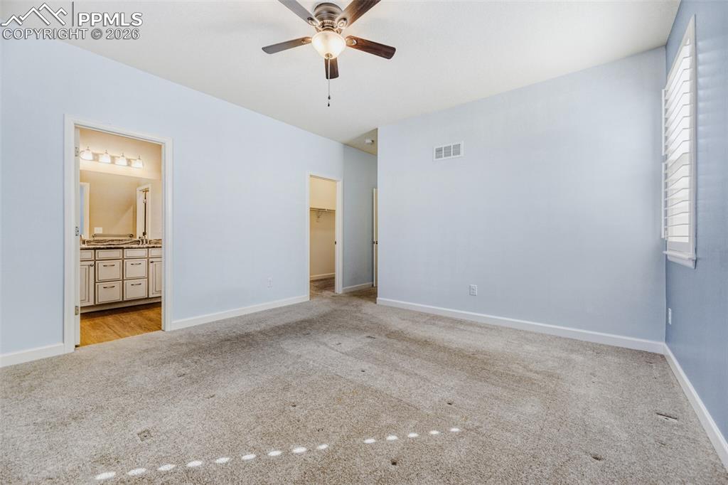 Image 23 of 49: walk-in closet, ceiling fans