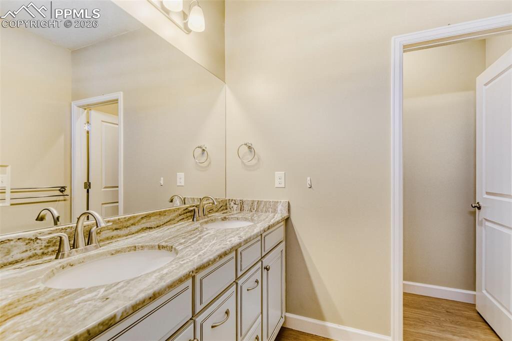 Image 25 of 49: double vanities, private water closet