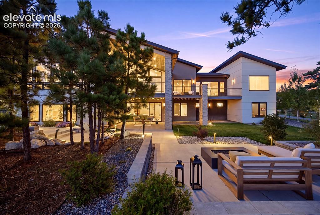 Image 11 of 50: Modern architectural design featuring large windows, multiple balconies, a 