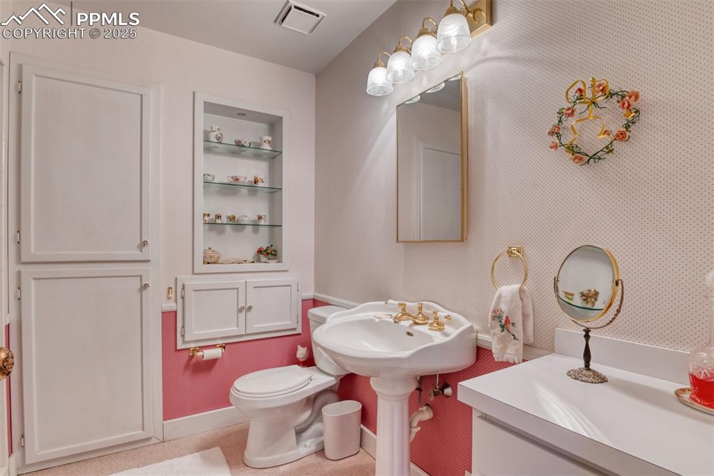 Image 35 of 50: Large bathroom adjacent to rec room