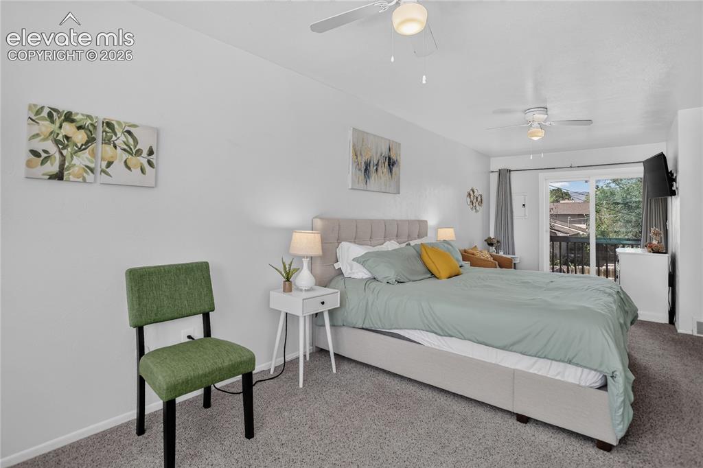 Image 10 of 32: primary bedroom with walk-out