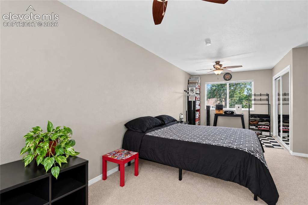 Image 25 of 32:  - primary bedroom with walk-out to deck