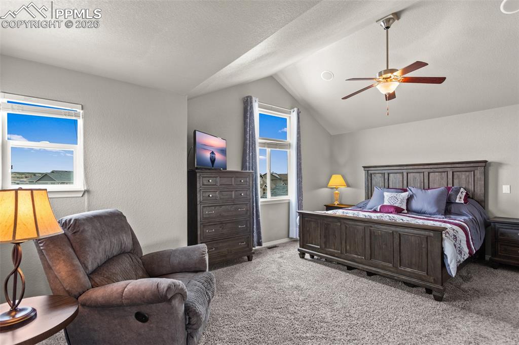 Image 11 of 21: Spacious primary suite featuring vaulted ceiling and extra room for a seati