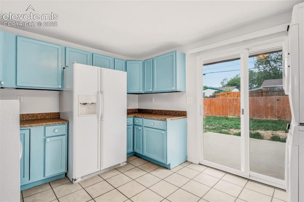 Image 7 of 19: Kitchen with walk out to backyard