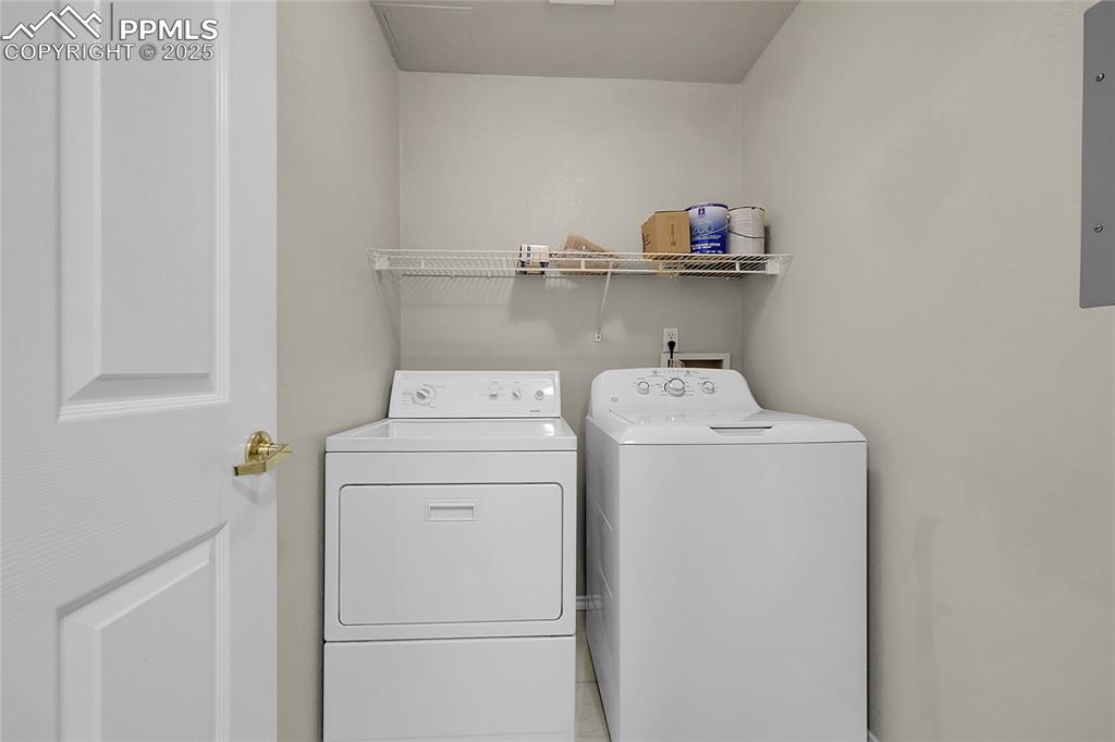 Image 11 of 18: Laundry room featuring washing machine and dryer